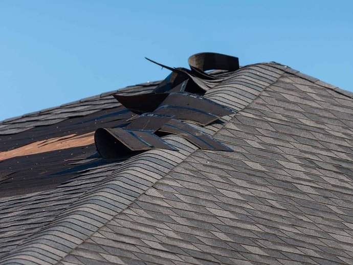 imageimage 5-3 Wind-loosened roofing and exterior damage